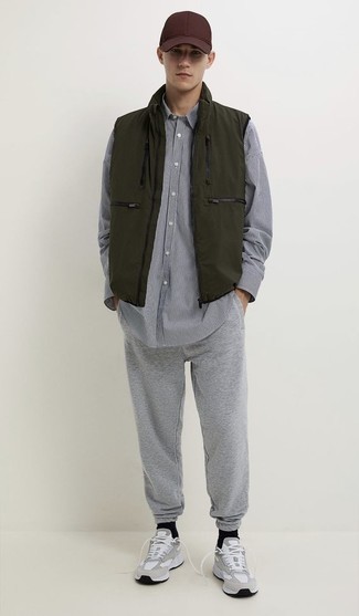 Men's Olive Gilet, White and Black Vertical Striped Long Sleeve Shirt, Grey Sweatpants, Grey Athletic Shoes