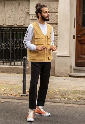 Yellow Canvas High Top Sneakers Outfits For Men: This casual combination of a yellow gilet and black chinos can only be described as ridiculously dapper. A pair of yellow canvas high top sneakers will add a whole new dimension to this look.
