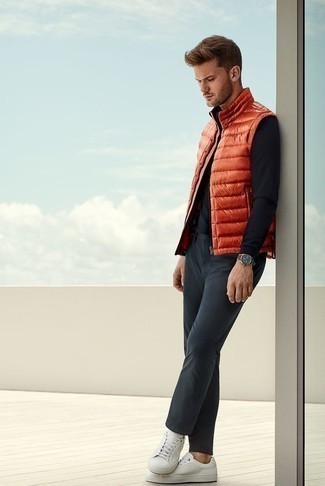 Men's Orange Quilted Gilet, Black Long Sleeve T-Shirt, Charcoal Chinos, White Canvas Low Top Sneakers