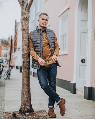 Tobacco Polo Neck Sweater Outfits For Men: Demonstrate your sartorial game in this pairing of a tobacco polo neck sweater and navy jeans. Introduce a pair of brown suede desert boots to your look and ta-da: this look is complete.