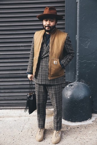 Charcoal Plaid Wool Suit Outfits: Such must-haves as a charcoal plaid wool suit and a tan gilet are the perfect way to inject some rugged sophistication into your casual wardrobe. If you need to instantly tone down this ensemble with shoes, add beige suede high top sneakers to this ensemble.