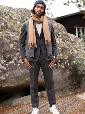 Charcoal Gilet Outfits For Men: This combination of a charcoal gilet and a charcoal suit is ideal when you need to look really refined. And if you want to instantly tone down this getup with footwear, why not complement this look with white canvas low top sneakers?
