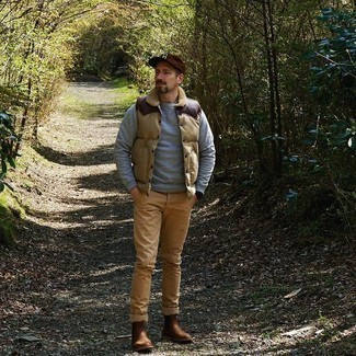 Dark Brown Baseball Cap Outfits For Men: You'll be amazed at how extremely easy it is for any gent to put together a street style getup like this. Just a beige quilted gilet worn with a dark brown baseball cap. A pair of brown leather chelsea boots will put an elegant spin on an otherwise mostly dressed-down outfit.
