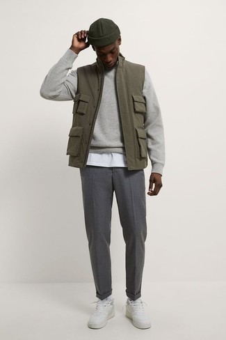 Charcoal Chinos Outfits: Teaming an olive gilet with charcoal chinos is a smart choice for a relaxed but dapper outfit. Serve a little outfit-mixing magic by rocking a pair of white leather low top sneakers.