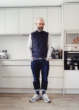 Blue Quilted Gilet Outfits For Men: A blue quilted gilet and navy jeans are wonderful menswear staples that will integrate nicely within your daily wardrobe. For something more on the cool and casual side to complement your ensemble, introduce grey athletic shoes to the mix.