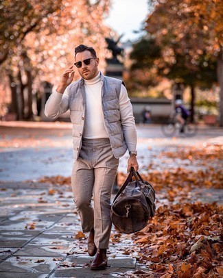 Charcoal Gilet Outfits For Men: Rock a charcoal gilet with brown wool chinos for an everyday ensemble that's full of style and character. Why not introduce a pair of dark brown leather chelsea boots to the mix for a dose of class?