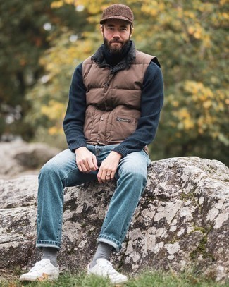 Brown Gilet Outfits For Men: A brown gilet and blue jeans are wonderful menswear staples that will integrate nicely within your daily routine. When in doubt about the footwear, go with white canvas low top sneakers.