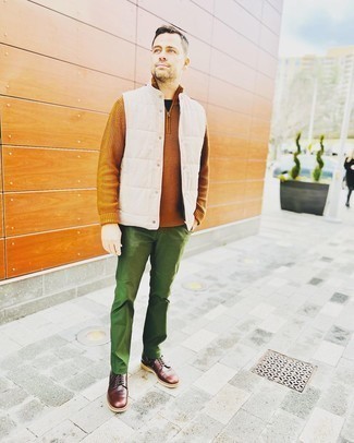 Olive Chinos Outfits: Show off your skills in menswear styling by wearing this casual pairing of a white quilted gilet and olive chinos. Complement your ensemble with dark brown leather casual boots for an extra touch of class.