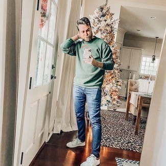 Green Print Long Sleeve T-Shirt Outfits For Men: To don a relaxed ensemble with a city style take, try teaming a green print long sleeve t-shirt with blue jeans. White canvas low top sneakers are a nice choice to complete your look.