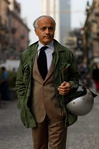 Green Military Jacket Outfits For Men: A green military jacket and a brown suit are a sophisticated outfit that every sharp gentleman should have in his wardrobe.