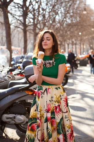 The combo of a green short sleeve blouse and a white floral full skirt makes for a kick-ass laid-back outfit.