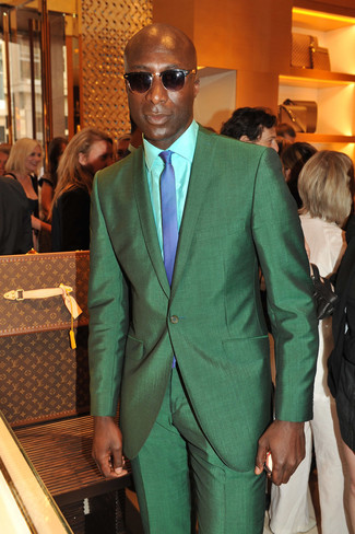 Dermot O'Leary wearing Green Suit, Mint Dress Shirt, Blue Check Tie, Dark Brown Sunglasses