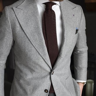 Dark Brown Knit Tie Outfits For Men: Combining a grey blazer and a dark brown knit tie is a surefire way to infuse an elegant touch into your current repertoire.