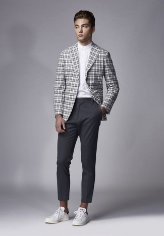 Charcoal Plaid Blazer Outfits For Men: For a look that's casually classy and wow-worthy, wear a charcoal plaid blazer with charcoal chinos. White leather low top sneakers add a whole new dimension to this ensemble.