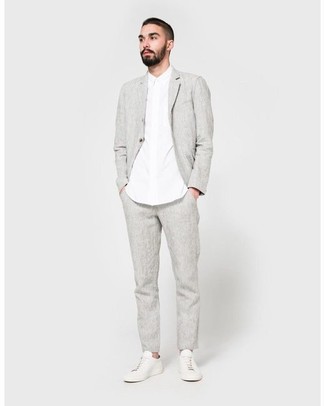 Grey Linen Chinos Outfits: Combining a grey linen blazer with grey linen chinos is an on-point option for a semi-casual ensemble. Complete this ensemble with a pair of white leather low top sneakers for a truly modern hi/low mix.