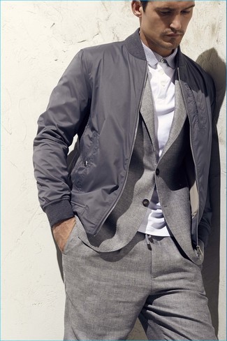 Grey Bomber Jacket Outfits For Men: This elegant pairing of a grey bomber jacket and a grey suit is a popular choice among the sartorially superior chaps.
