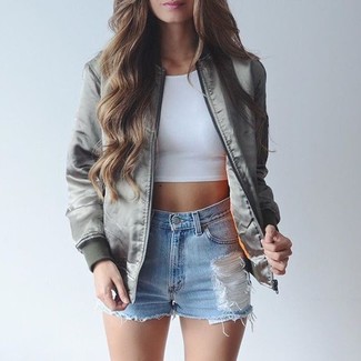 For something more on the casually edgy end, wear this combo of a grey bomber jacket and light blue ripped denim shorts.