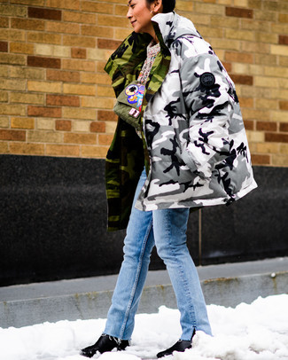 Black and White Leather Ankle Boots Outfits: If you prefer off-duty style, why not wear a grey camouflage parka with light blue jeans? For a sleeker aesthetic, complete this look with a pair of black and white leather ankle boots.