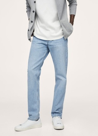 Light Blue Jeans Outfits For Men: Why not wear a grey cardigan and light blue jeans? Both items are totally practical and will look good when worn together. Why not finish with a pair of white leather low top sneakers for a dressed-down feel?