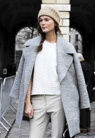 Irina Kulikova wearing Grey Coat, White Quilted Crew-neck T-shirt, Grey Skinny Pants, Beige Beanie