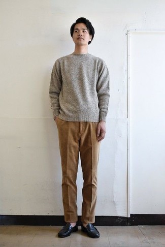 Brown Corduroy Chinos Outfits: For a look that's pared-down but can be modified in plenty of different ways, team a grey crew-neck sweater with brown corduroy chinos. Complement this ensemble with a pair of black leather loafers for an extra dose of style.