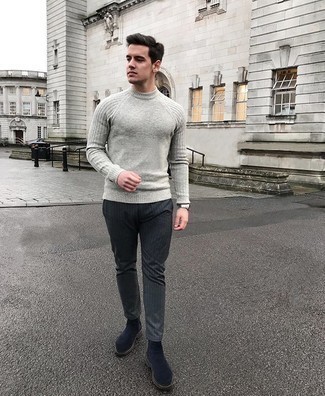 Navy Suede Chelsea Boots Outfits For Men: A grey crew-neck sweater and charcoal vertical striped chinos are an easy way to introduce played down dapperness into your casual styling lineup. Give a more sophisticated twist to this outfit by rocking a pair of navy suede chelsea boots.