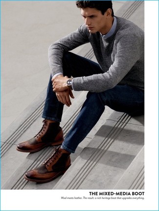On days when comfort is key, marry a grey crew-neck sweater with navy jeans. Why not take a classic approach with shoes and add a pair of brown leather brogue boots to the equation?