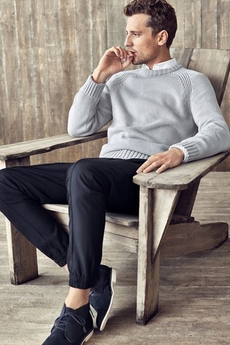 A grey crew-neck sweater and black chinos are a combination that every fashionable gent should have in his casual sartorial arsenal. Complement this look with navy suede desert boots and the whole ensemble will come together.
