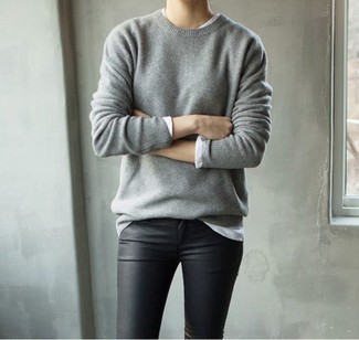 Consider pairing a grey crew-neck sweater with black leather skinny pants for a comfortable outfit that's also well-executed.