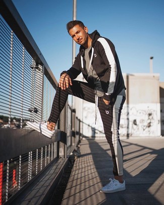 Black and White Track Suit Outfits For Men: Try teaming a black and white track suit with a grey crew-neck t-shirt to be both modern casual and functional. If you want to feel a bit fancier now, introduce a pair of white low top sneakers to the mix.