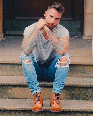 Tobacco Leather Brogue Boots Outfits: Try teaming a grey crew-neck t-shirt with blue ripped skinny jeans for an easy-going outfit. You can go down a classier route in the footwear department by wearing a pair of tobacco leather brogue boots.