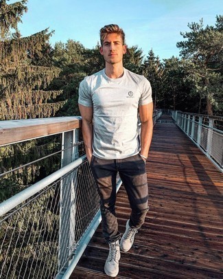 Grey Canvas Work Boots Outfits For Men: This pairing of a grey crew-neck t-shirt and dark brown chinos is the perfect balance between functional and dapper. You could perhaps get a little creative in the shoe department and tone down your ensemble with grey canvas work boots.