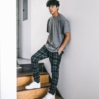 Dark Green Plaid Chinos Outfits: A grey crew-neck t-shirt and dark green plaid chinos make for the ultimate laid-back style for today's man. Let your outfit coordination sensibilities truly shine by finishing this outfit with white leather low top sneakers.