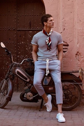 Charcoal Chinos with Low Top Sneakers Hot Weather Outfits: This casually cool ensemble is easy to break down: a grey crew-neck t-shirt and charcoal chinos. Low top sneakers finish this getup quite well.