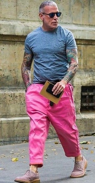 Nick Wooster wearing Grey Crew-neck T-shirt, Hot Pink Chinos, Pink Suede Brogues, Black Sunglasses