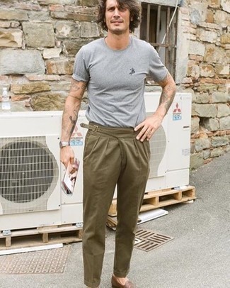Dark Brown Leather Loafers with Teal Chinos Hot Weather Outfits: This pairing of a grey crew-neck t-shirt and teal chinos is proof that a simple casual outfit doesn't have to be boring. Make your look a bit classier by finishing off with dark brown leather loafers.
