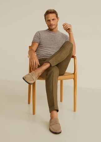 Olive Chinos with Beige Suede Loafers Hot Weather Outfits: This combination of a grey crew-neck t-shirt and olive chinos is undeniable proof that a straightforward off-duty ensemble can still be really interesting. You can take a classic approach with shoes and add a pair of beige suede loafers to your outfit.