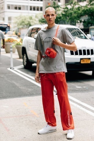 Orange Sweatpants Outfits For Men: This casual combo of a grey print crew-neck t-shirt and orange sweatpants is a tested option when you need to look dapper but have zero time. When it comes to shoes, introduce a pair of white athletic shoes to the equation.