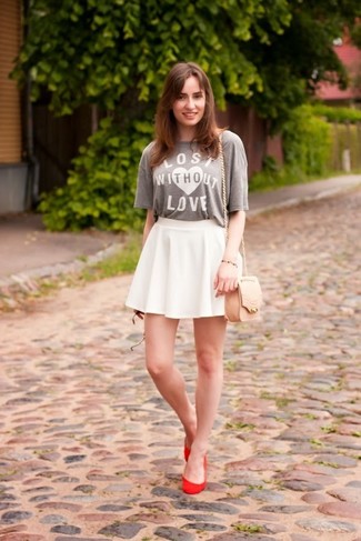 White Skater Skirt Outfits: Opt for a grey print crew-neck t-shirt and a white skater skirt for relaxed dressing with a modern twist. Red suede ballerina shoes integrate really well within a great deal of looks.