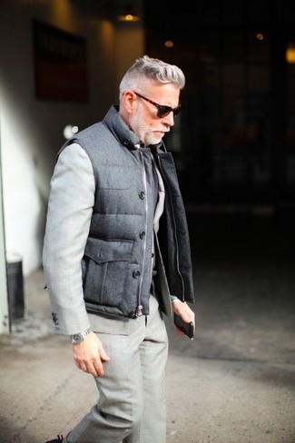 Grey Quilted Gilet Outfits For Men: This polished combination of a grey quilted gilet and a grey suit is a frequent choice among the sartorially superior chaps.