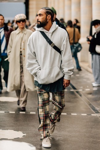 Beige Plaid Chinos Outfits: A grey hoodie and beige plaid chinos are a combo that every style-conscious gent should have in his casual wardrobe. Introduce beige canvas low top sneakers to the equation et voila, this getup is complete.