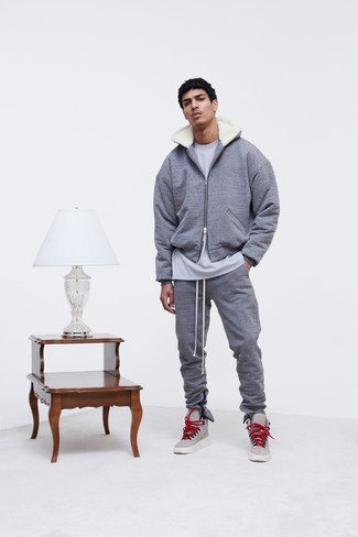 Silver Leather High Top Sneakers Outfits For Men: Putting together a grey hoodie with grey sweatpants is a wonderful option for a casually cool outfit. Silver leather high top sneakers look amazing here.