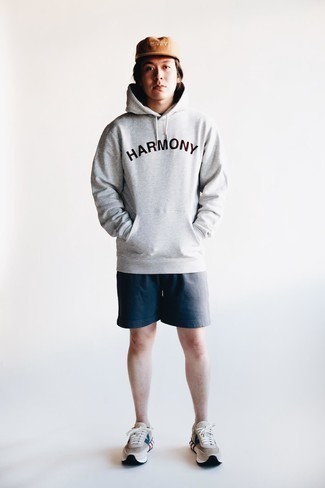Navy Sports Shorts Outfits For Men: A grey print hoodie and navy sports shorts are the perfect way to introduce effortless cool into your current outfit choices. For extra fashion points, add grey athletic shoes to the equation.