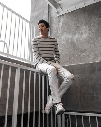White Ripped Jeans Outfits For Men: Infuse some fun into your daily fashion mix with a grey horizontal striped crew-neck sweater and white ripped jeans. Let your styling sensibilities truly shine by rounding off your look with a pair of white canvas low top sneakers.