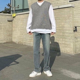 Men's White Leather Low Top Sneakers, Grey Jeans, White Long Sleeve T-Shirt, Grey Sweater Vest