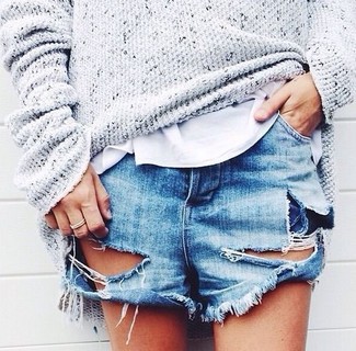 Blue Ripped Denim Shorts Outfits For Women: Why not consider teaming a grey knit oversized sweater with blue ripped denim shorts? These two items are totally comfortable and will look nice when paired together.