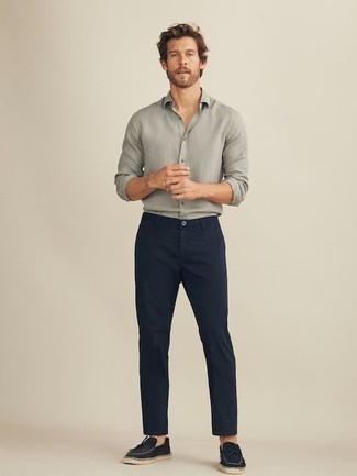 Navy Canvas Loafers Outfits For Men: Why not opt for a grey long sleeve shirt and navy chinos? Both pieces are super functional and look good when teamed together. Navy canvas loafers will bring a sense of refinement to an otherwise mostly dressed-down ensemble.