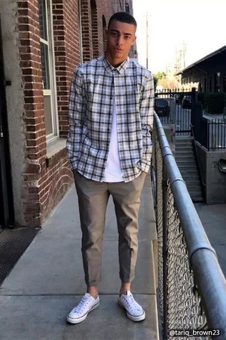 Grey Flannel Long Sleeve Shirt Outfits For Men: Reach for a grey flannel long sleeve shirt and grey chinos for kick-ass menswear style. Our favorite of a variety of ways to complete this look is with a pair of white canvas low top sneakers.