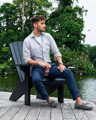 Blue Vertical Striped Chinos Outfits: To pull together a casual menswear style with a modern twist, rock a grey linen long sleeve shirt with blue vertical striped chinos. Let your expert styling really shine by finishing this outfit with grey suede driving shoes.