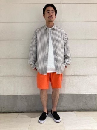 Yellow Shorts Outfits For Men: A grey vertical striped long sleeve shirt and yellow shorts are the perfect way to introduce muted dapperness into your daily lineup. Black canvas slip-on sneakers look great finishing off your ensemble.